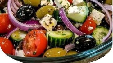 “Classic Greek Salad, fresh vegetables, cucumber, tomatoes, red onion, Kalamata olives, feta cheese, olive oil dressing, refreshing, Mediterranean flavors, healthy salad, traditional Greek recipe, vibrant colors, healthy eating, delicious Greek dish”