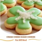 "Soft, sweet cream cheese sugar cookies topped with colorful sprinkles, freshly baked and placed on a plate."