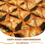 "Crispy baked crab rangoons with a golden-brown, crunchy exterior, stuffed with a creamy crab and cream cheese filling, served on a plate with dipping sauce."