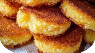 "Crispy fried cornbread pieces, golden brown and crunchy on the outside with a soft interior."