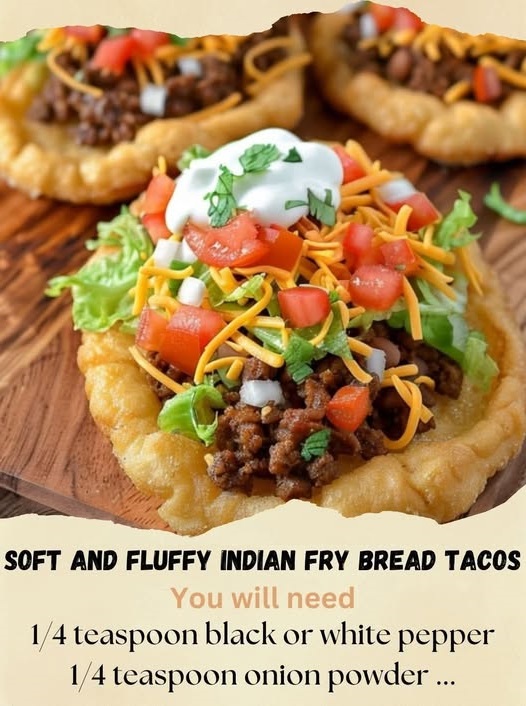"Indian fry bread tacos with a soft, fluffy fry bread shell filled with seasoned meat, lettuce, and toppings."