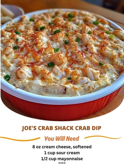 "Creamy, Rich Crab Dip Filled with Shredded Crab Meat, Topped with Melted Cheese and a Light Golden Brown Crust, Served in a Small Bowl with Crispy Tortilla Chips for Dipping."