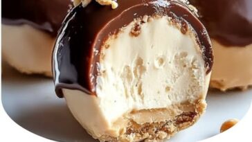 “No-Bake Peanut Butter Cheesecake Balls, peanut butter cheesecake, no-bake dessert, decadent treat, creamy cheesecake balls, sweet dessert, peanut butter dessert, easy dessert recipe, rich cheesecake, bite-sized treats, indulgent dessert, no-bake peanut butter balls, quick dessert, creamy treat, delicious peanut butter dessert”