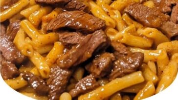 One-pot smoky honey BBQ steak pasta with tender steak, smoky BBQ sauce, and pasta, garnished with fresh herbs."