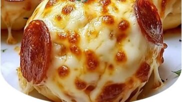 "Pepperoni pizza bombs filled with melted cheese, pepperoni, and wrapped in golden, fluffy dough."