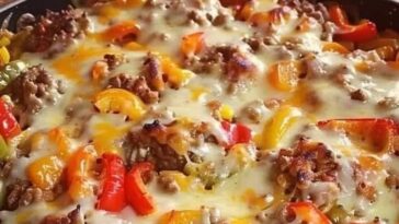 "Delicious stuffed pepper casserole with a mix of rice, ground beef, bell peppers, and melted cheese, offering a comforting one-pot meal."