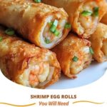 "Crunchy homemade shrimp egg rolls with a golden, crispy exterior, filled with shrimp, vegetables, and seasonings served on a plate with dipping sauce."