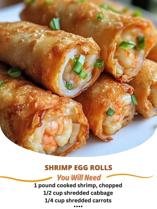 "Crunchy homemade shrimp egg rolls with a golden, crispy exterior, filled with shrimp, vegetables, and seasonings served on a plate with dipping sauce."