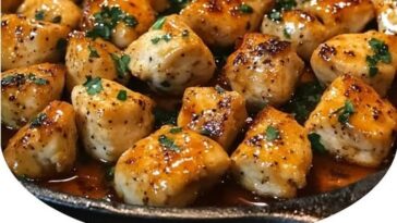 "Texas Roadhouse-style butter chicken skillet with tender chicken, creamy butter sauce, and herbs, served in a cast iron skillet."