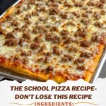 A slice of classic school pizza with a crispy golden crust, topped with tomato sauce, melted cheese, and a sprinkle of herbs, placed on a paper tray.