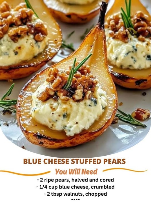 Blue Cheese Stuffed Pears served on a platter, with ripe pear halves filled with creamy blue cheese and garnished with fresh herbs and a drizzle of honey.