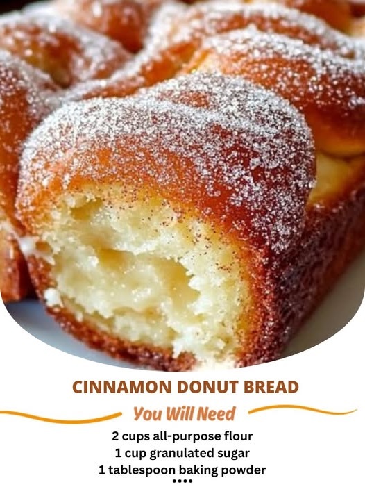 Slices of warm, golden-brown cinnamon donut bread, topped with a sugary cinnamon glaze, resting on a plate.
