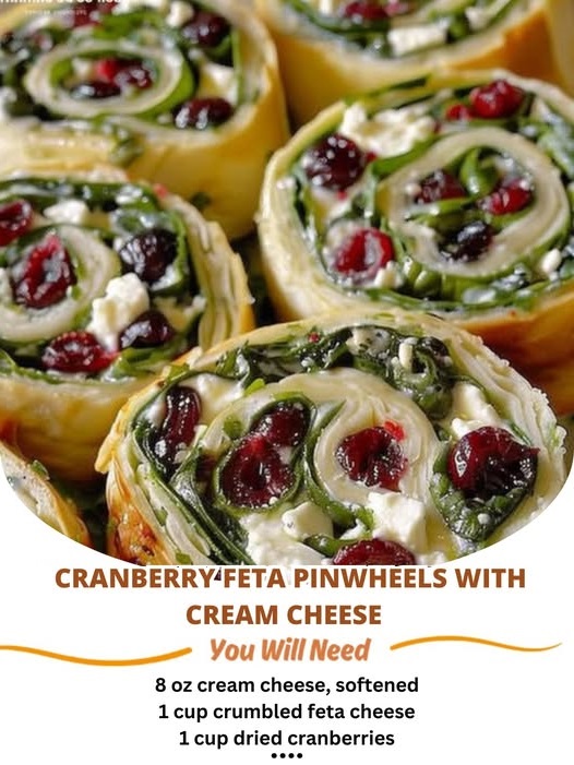 Colorful cranberry feta pinwheels with cream cheese, rolled into bite-sized swirls, showcasing vibrant red cranberries and creamy cheese filling.