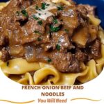A hearty plate of French Onion Beef and Noodles, featuring tender beef, caramelized onions, and noodles in a rich, savory sauce, garnished with fresh herbs.