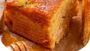 Jalapeño cornbread with a golden, crispy crust, topped with chopped jalapeños