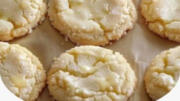 plate of soft, golden Kentucky Butter Cake Cookies, drizzled with a sweet buttery glaze, showcasing their rich texture and slight crisp on the edges.