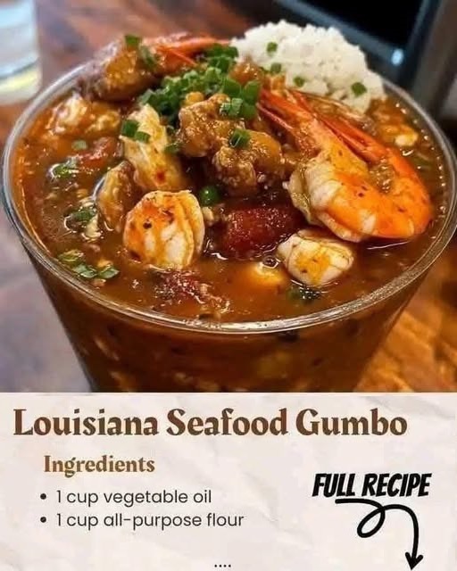 A bowl of Louisiana Seafood Gumbo filled with shrimp, crab, and sausage, simmered in a rich, dark roux with vegetables, served with a side of rice.