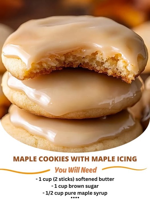 Maple cookies topped with a glossy maple icing, arranged on a plate with a rustic, warm background.