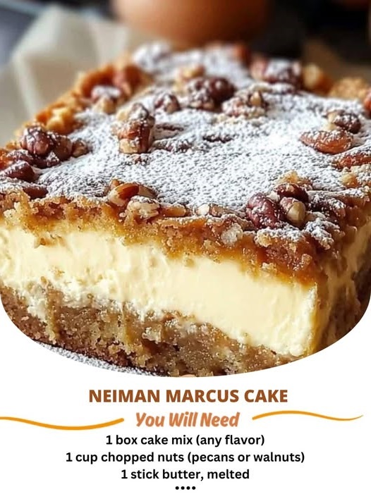A slice of Neiman Marcus Cake with layers of moist cake, a rich chocolate frosting, and garnished with chopped nuts.
