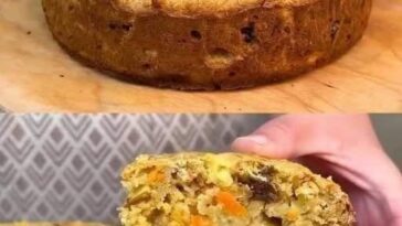 A slice of golden-brown apple, carrot, and oat breakfast bake topped with a sprinkle of cinnamon, resting on a plate next to a fork.