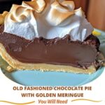 Old fashioned chocolate pie topped with a golden, fluffy meringue, showcasing a rich, smooth chocolate filling in a flaky pie crust