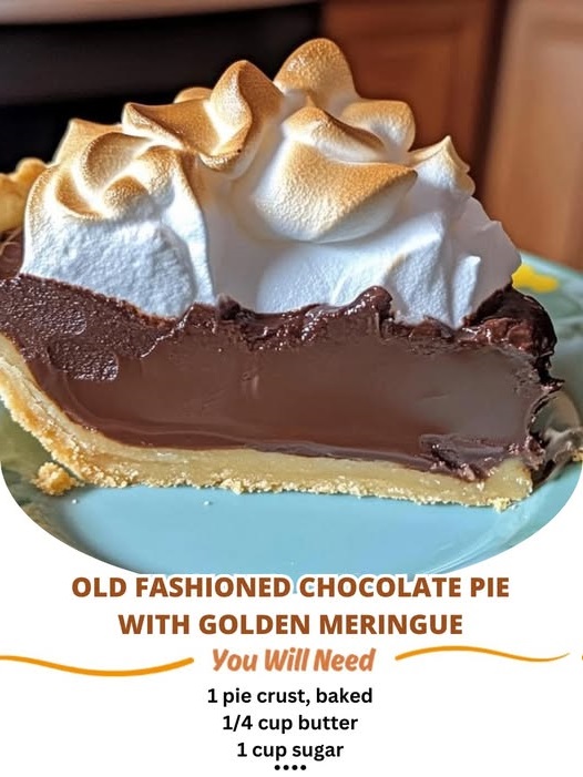 Old fashioned chocolate pie topped with a golden, fluffy meringue, showcasing a rich, smooth chocolate filling in a flaky pie crust