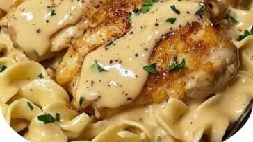 A plate of One-Pan Creamy Garlic Butter Chicken with egg noodles, featuring tender chicken breast, creamy garlic butter sauce, and perfectly cooked noodles.