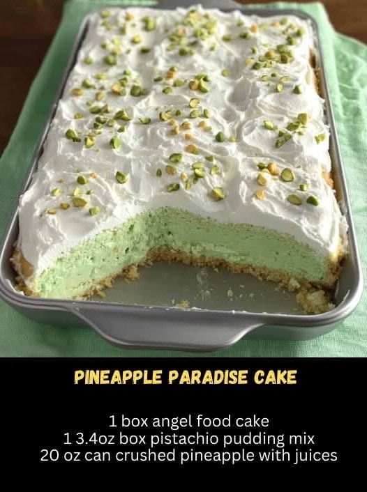 A slice of Pineapple Paradise Cake with chunks of pineapple, toasted nuts, and a golden, glistening glaze on top, set on a rustic wooden table, evoking a tropical, nutty delight.