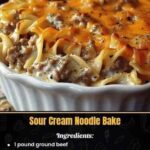 A baked dish of sour cream noodle bake with creamy layers of pasta, ground meat, and cheese, topped with a golden-brown crust.