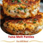 Golden-brown tuna melt patties with melted cheese on top, garnished with fresh herbs, placed on a plate