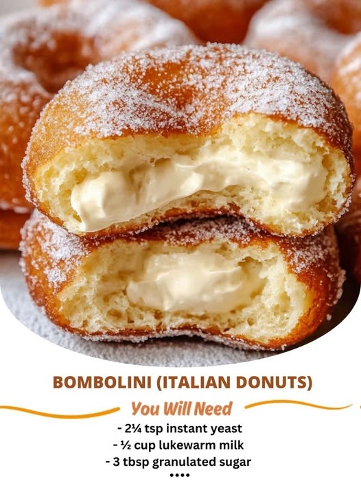 Golden, fluffy Bombolini Italian donuts filled with sweet cream or jam, dusted with powdered sugar. A traditional Italian pastry for any occasion.