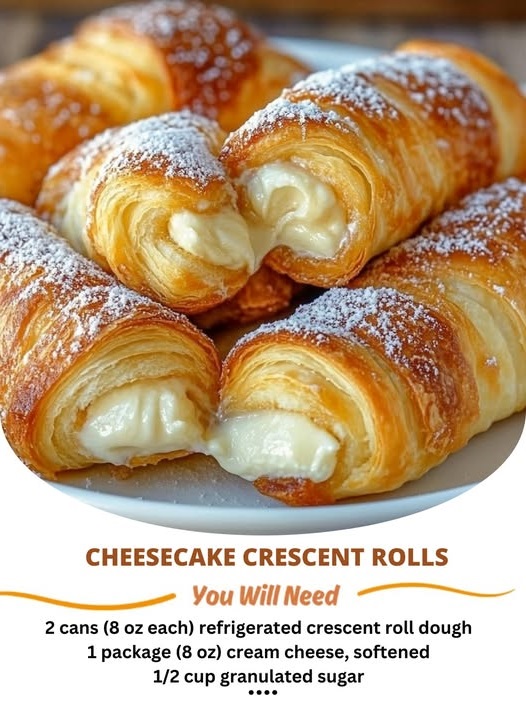 Golden, flaky crescent rolls stuffed with a creamy cheesecake filling and topped with a dusting of powdered sugar.