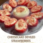Halved strawberries filled with creamy cheesecake filling, piped in a swirl and topped with graham cracker crumbs.
