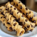 Golden, twisted pastry filled with chocolate chip cookie dough and dusted with powdered sugar.