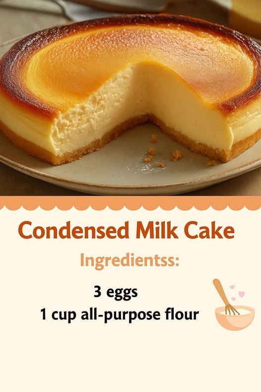 Condensed Milk Cake with a soft, fluffy texture, topped with a light glaze and garnished with a few decorative swirls