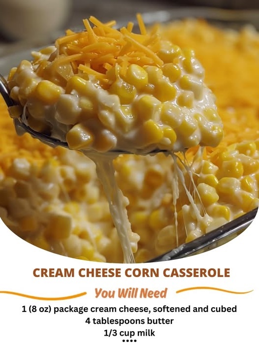 Baked cream cheese corn casserole in a dish, golden and bubbly on top with visible corn kernels and melted cheese.