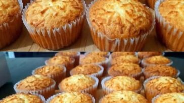 A batch of golden-brown cupcake cheese muffins with a fluffy texture and a cheesy topping, arranged on a wooden surface.