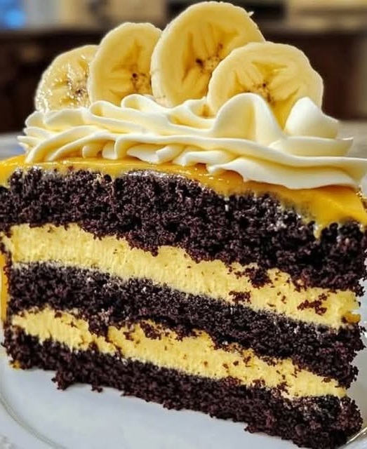 Double Chocolate Banana Layer Cake with rich chocolate frosting and sliced bananas between layers