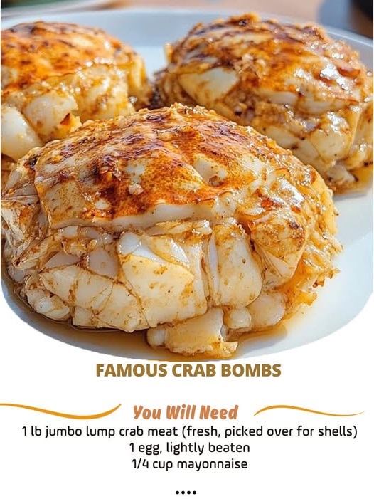 Golden-brown crab bombs served on a plate, garnished with parsley and accompanied by lemon wedges.