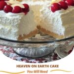 A slice of Heaven on Earth Cake with layers of fluffy cake, whipped cream, and fruit, topped with a light dusting of sugar.