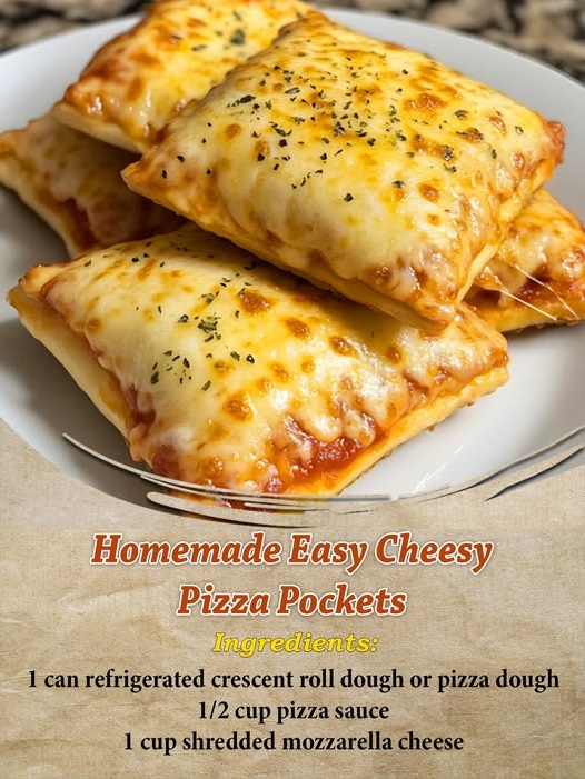 Golden-brown homemade pizza pockets filled with melted cheese and marinara, with one pocket split open showing the gooey center.