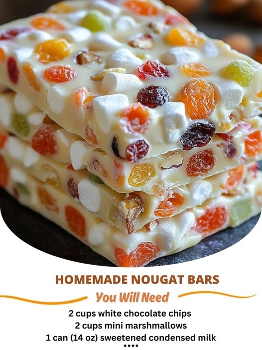 Delicious homemade nougat bars with a chewy, fluffy nougat base, nuts, and chocolate coating. Perfect sweet treat for any occasion.