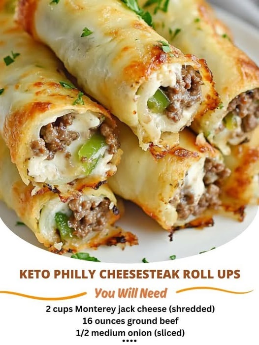 Keto Philly Cheesesteak roll-ups featuring thinly sliced steak, sautéed bell peppers, onions, and melted cheese, all wrapped in a low-carb, flourless wrap, garnished with fresh herbs.