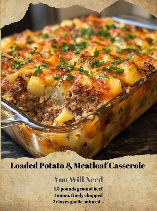 Baked casserole with layers of seasoned meatloaf, creamy mashed potatoes, melted cheese, and crispy bacon bits on top.