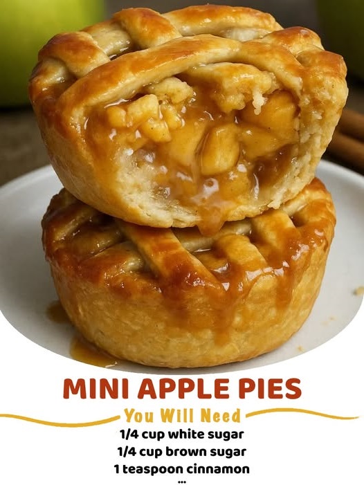 Golden-brown mini apple pie bites wrapped in crescent dough, sprinkled with cinnamon sugar, and arranged on a plate.