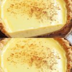 A golden-brown old-fashioned custard pie with a flaky crust, sliced to reveal a smooth, creamy filling.