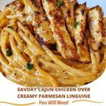 Cajun-spiced chicken breast served over creamy parmesan linguine, garnished with fresh herbs.