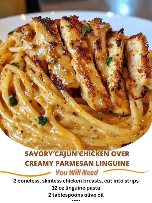 Cajun-spiced chicken breast served over creamy parmesan linguine, garnished with fresh herbs.