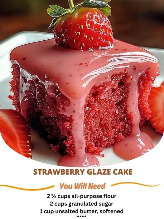 A moist strawberry glaze cake topped with a glossy layer of vibrant strawberry glaze, garnished with fresh strawberries.