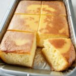 Super Easy Rice Cake (Milk Custard Cake) with a smooth, golden top and a soft, creamy texture.